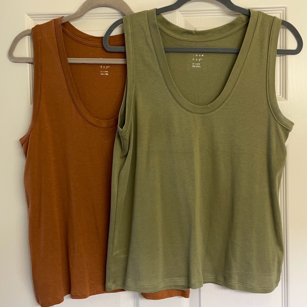 SOLD Two women’s sleeveless tops.